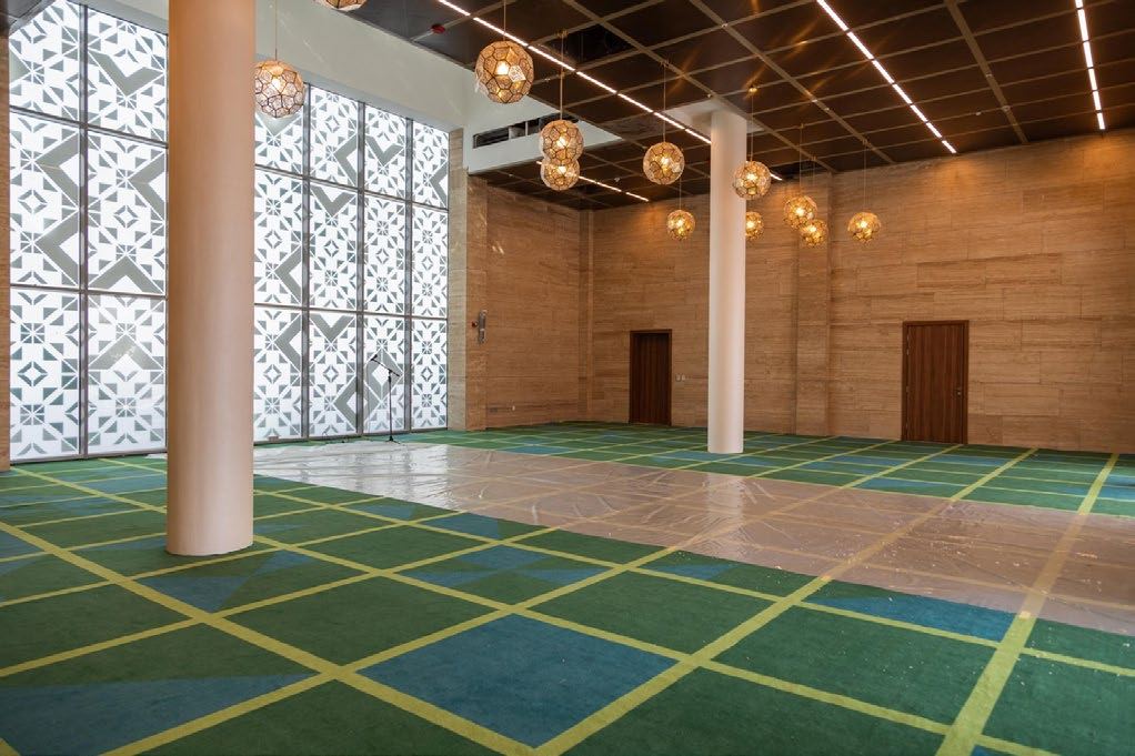 Finished prayer hall with patterned screens at Amaad Business Park