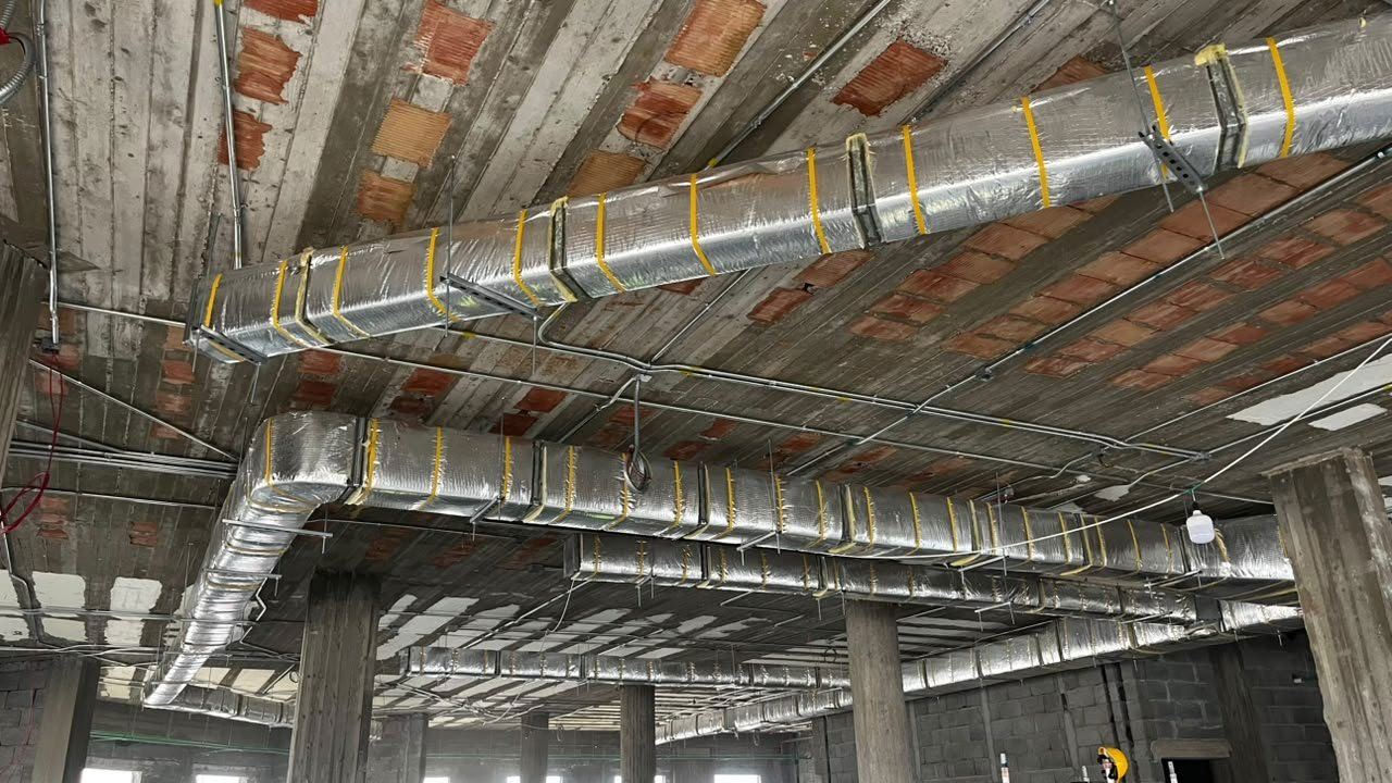 Main insulated ductwork run with support hangers