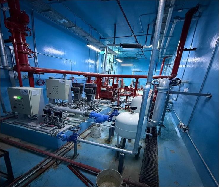 Fire pump room with red firefighting pipework